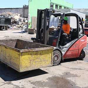 Forklift with sorting bin and rotator attachment